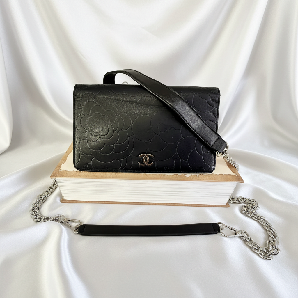 CHANEL Black Camellia Embossed Lambskin Leather
