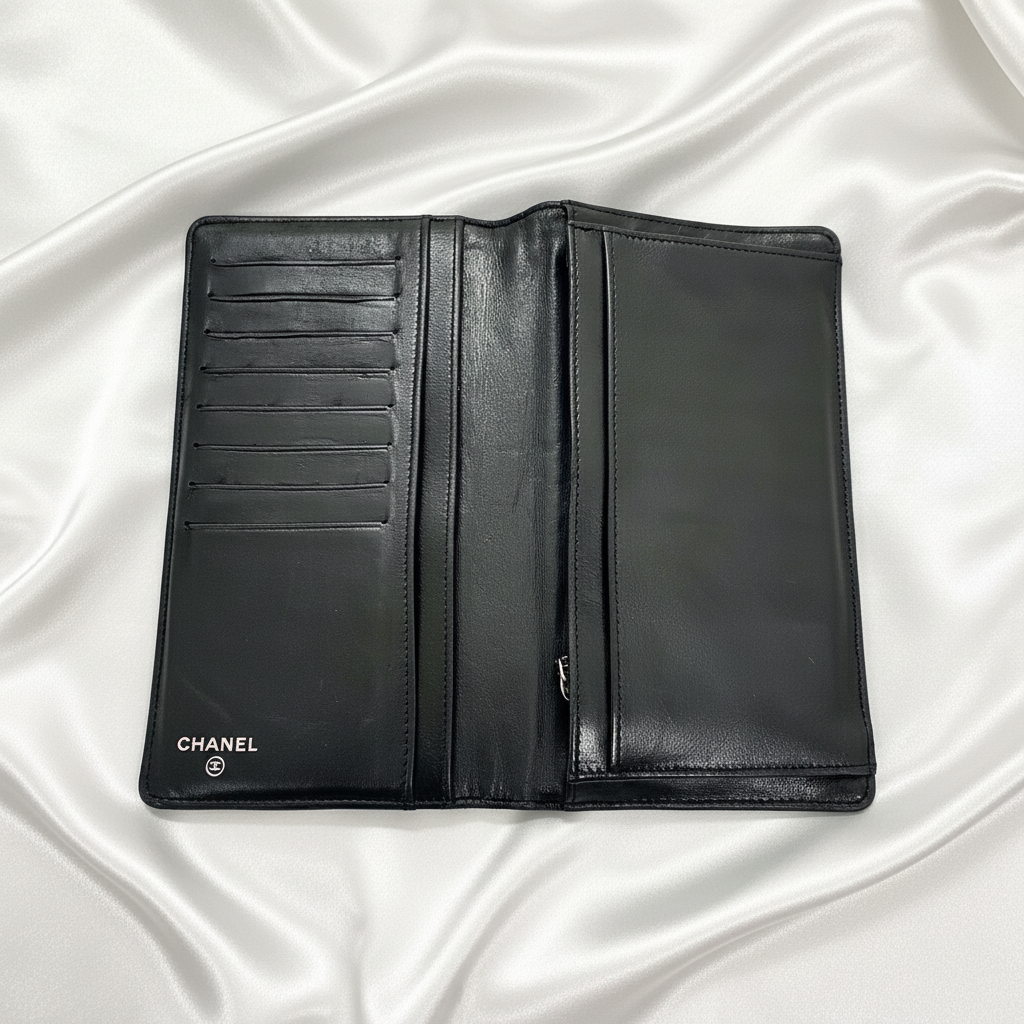 CHANEL Black Camellia Embossed Lambskin Leather